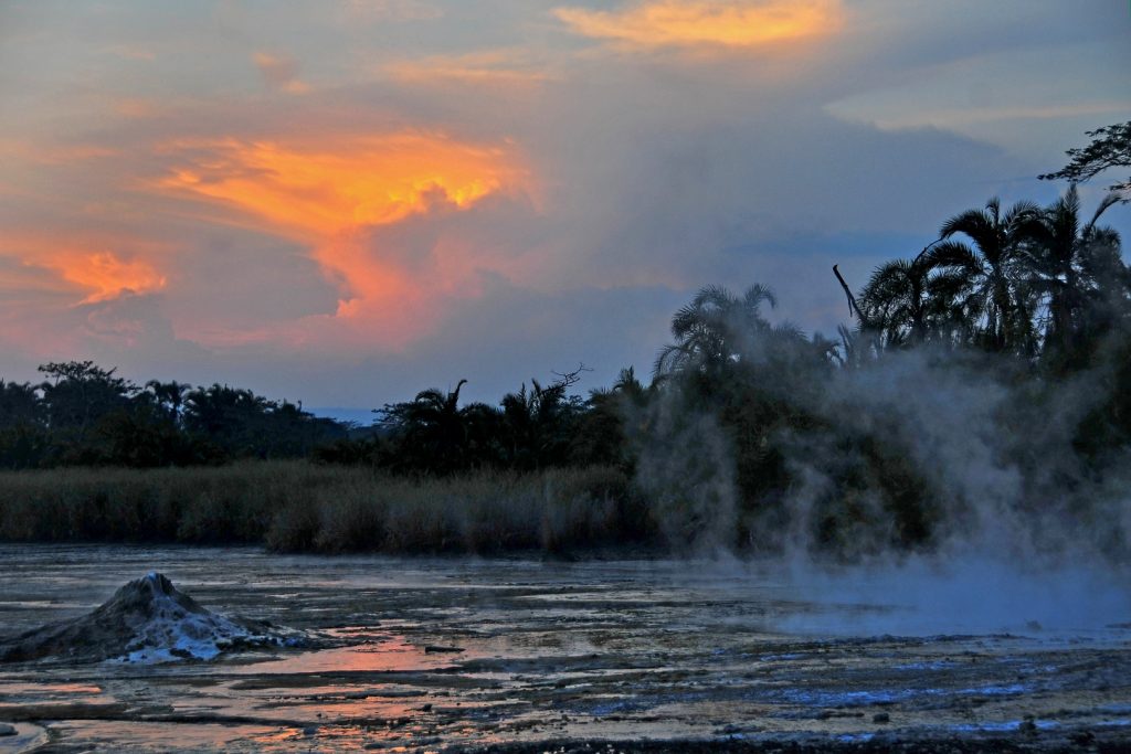 An evening view of smoke from Sempaya Hot Springs, one of the encounters on budget discover Semuliki tour