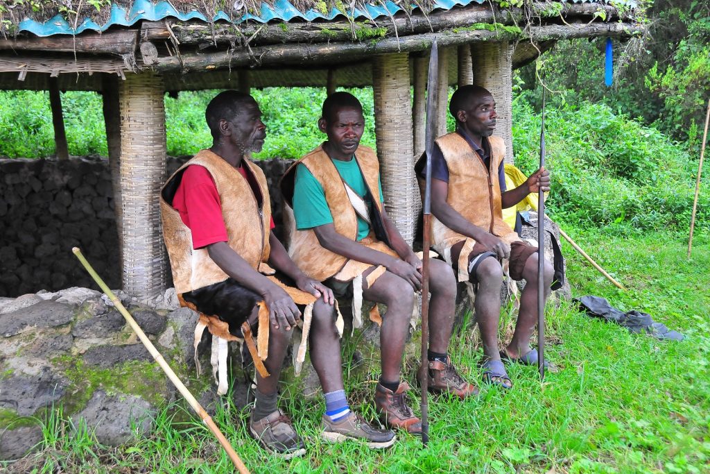 Batwa men at the Boma Cultural Village in Semuliki National Park. Depicting what you will encounter on your budget Batwa and birding safari
