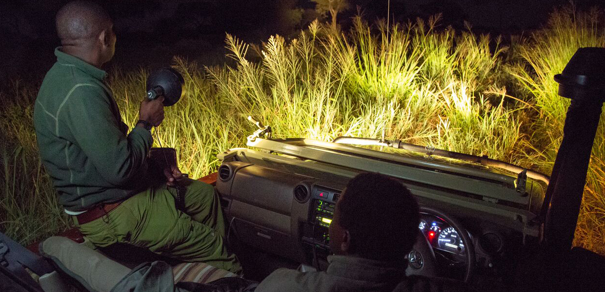 Visitors Enjoying A Night Game Drive In Uganda